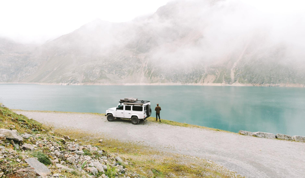 Alex Strohl Minimalist Landscape Photograph - Landrover at a Lake