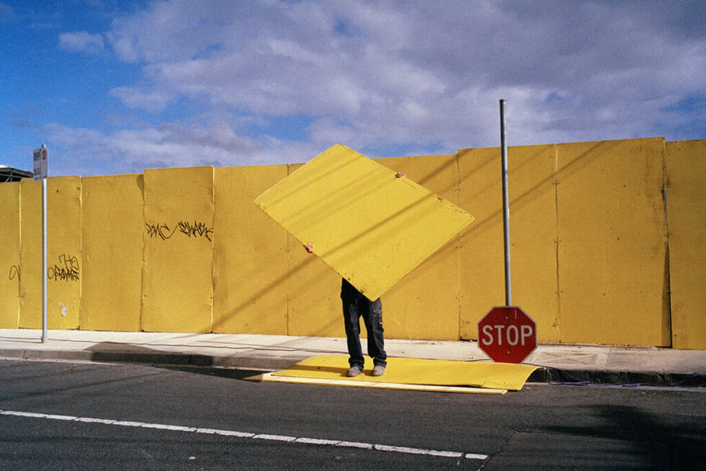 Melbourne Street Photography by Jesse Marlow - Stop Sign and Yellow wall